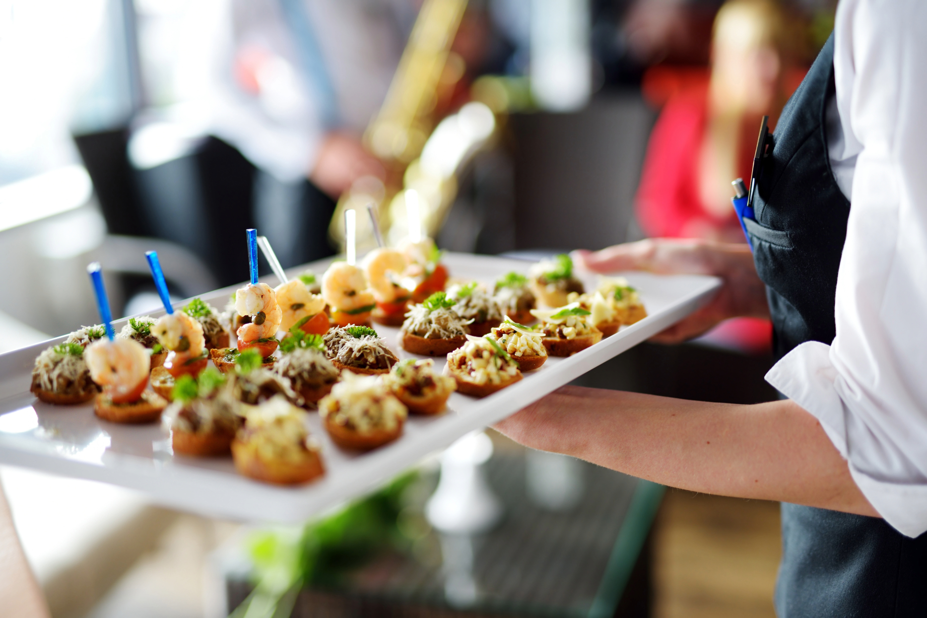 Waiter serving tray of hors d'oeuvres at a corporate event in Brewster, Cape Cod