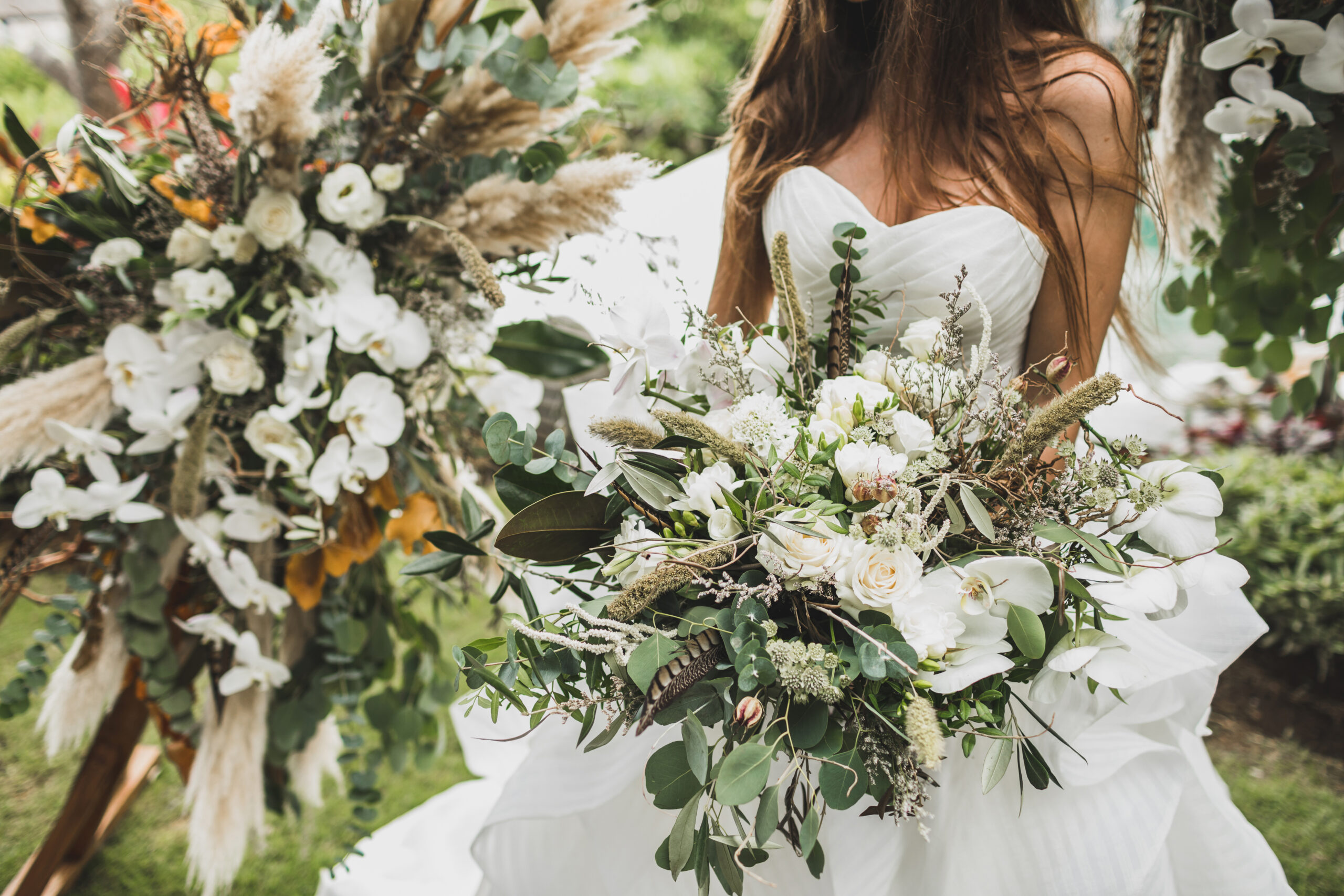 woman-holding-in-hands-big-wedding-bouquet-in-Brewster, Cape Cod